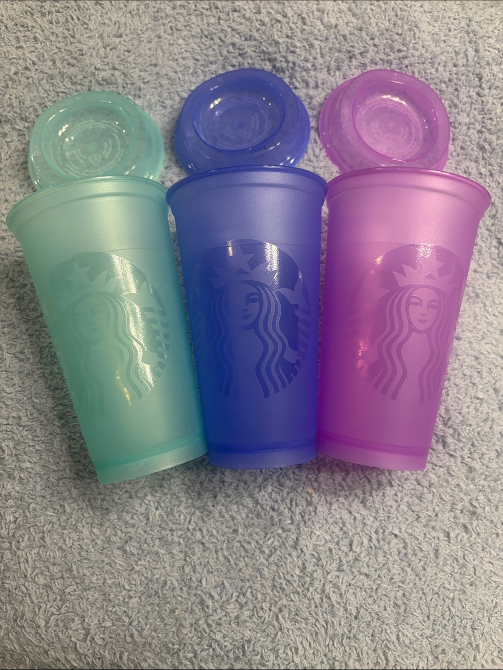 Collectors - Starbucks turquoise, Blue, and fiusha Reusable 16oz cups with lids.